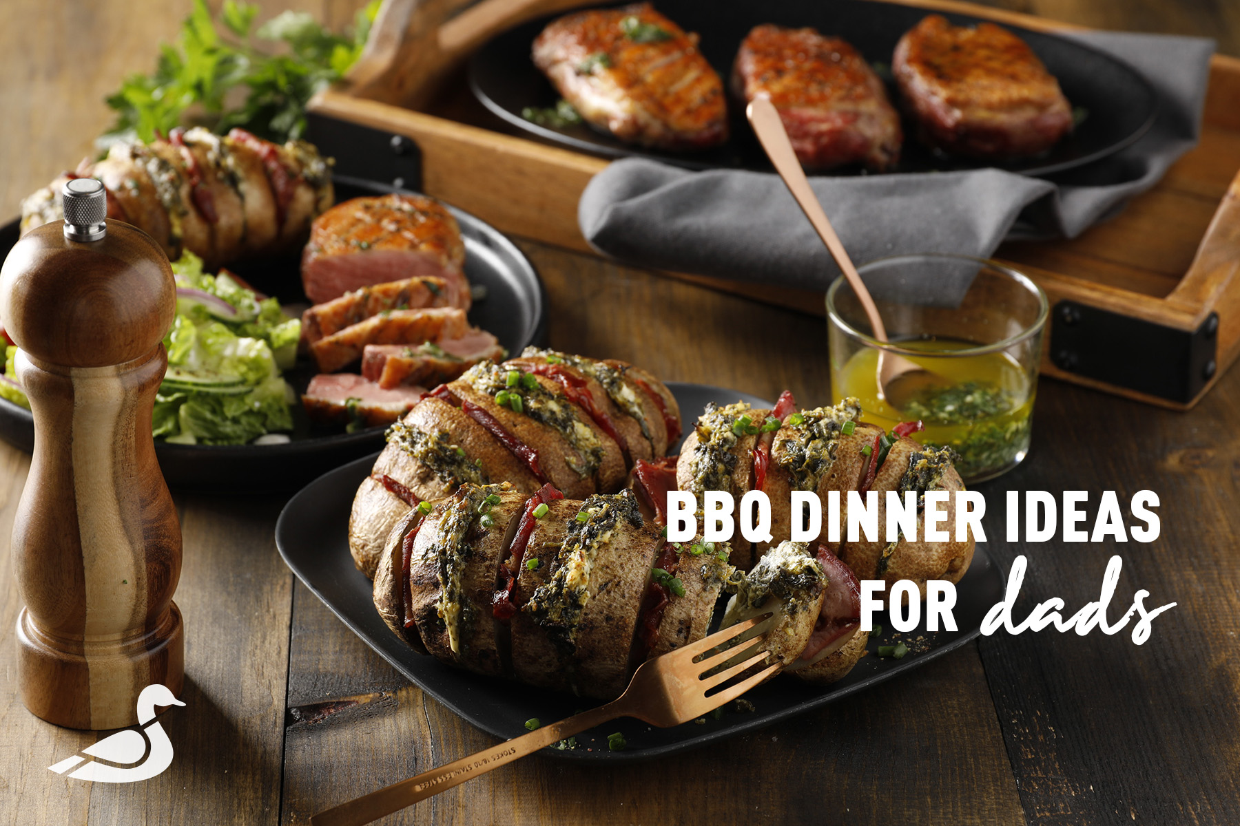 Grilled duck and hasselback potatoes on the barbecue.